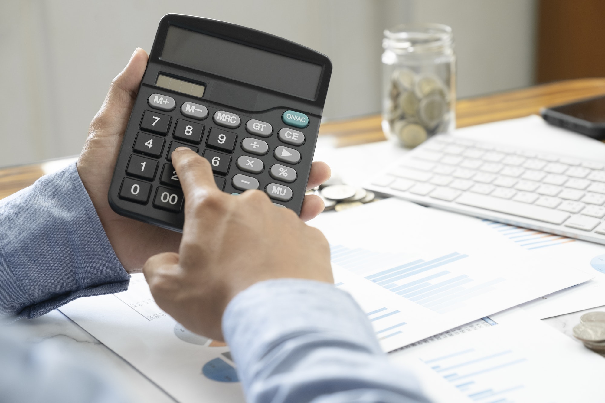 Accountant or banker calculate the cash bill.