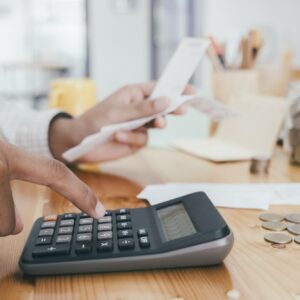 Accountant or banker calculate the cash bill.