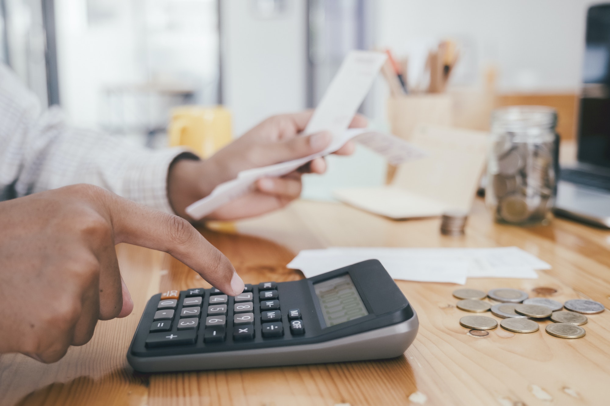 Accountant or banker calculate the cash bill.