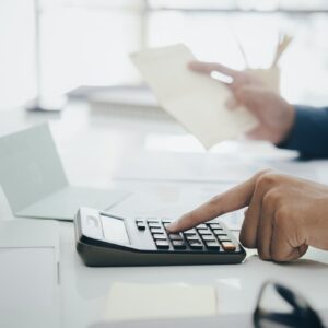 Accountant or banker calculate the cash bill.