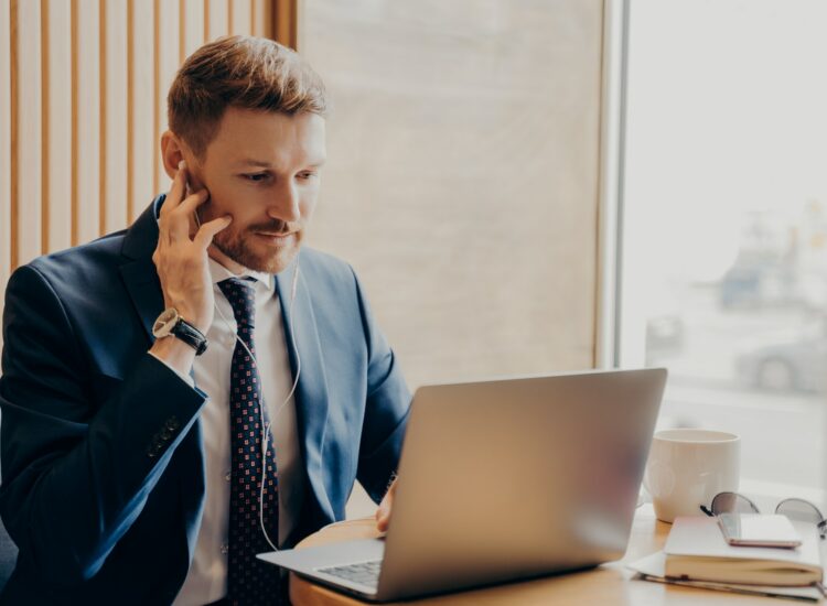 Male finance accountant working online through laptop