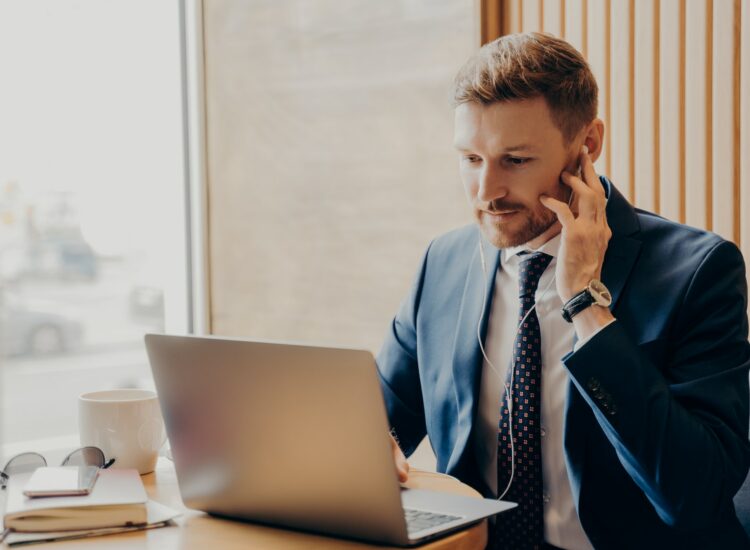 Male finance accountant working online through laptop