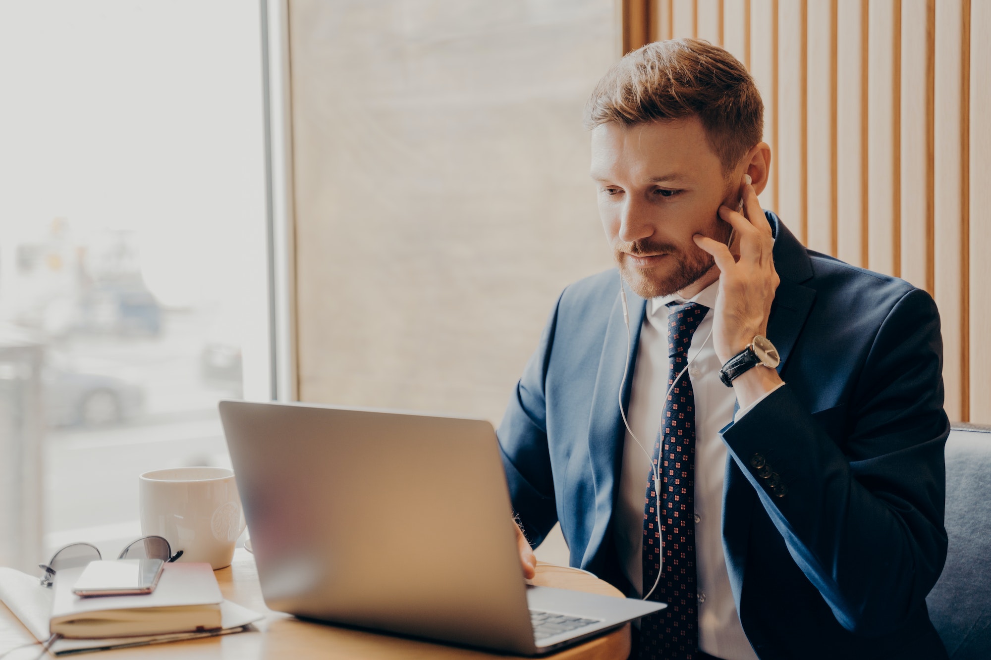 Male finance accountant working online through laptop