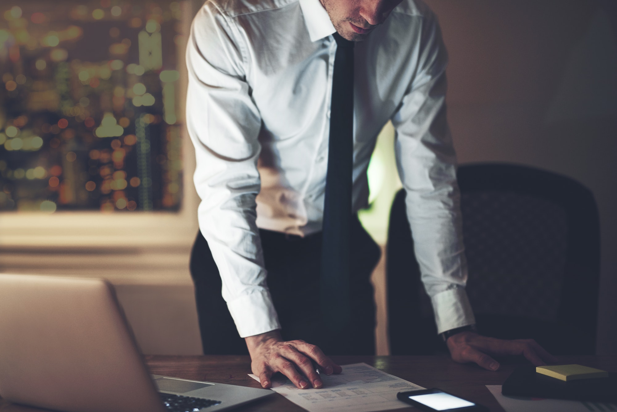 The accountant standing and working in office